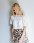 'IT COMES IN WAVES' T-SHIRT IN CREAM NEON