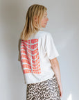 'IT COMES IN WAVES' T-SHIRT IN CREAM NEON