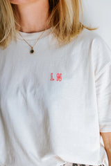 'IT COMES IN WAVES' T-SHIRT IN CREAM NEON