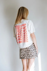 'IT COMES IN WAVES' T-SHIRT IN CREAM NEON